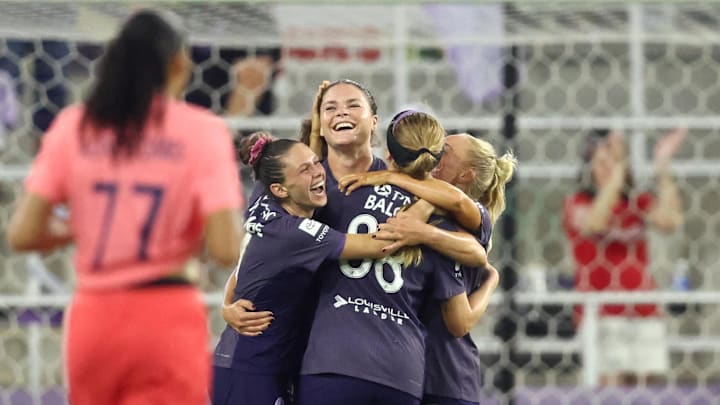 Racing Louisville FC forward Emma Sears (13) celebrates with teammates after scoring a goal against the North Carolina Courage in the second half at Lynn Family Stadium 