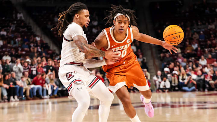Feb 22, 2025; Columbia, South Carolina, USA; Texas Longhorns guard Tre Johnson (20) loses the ball driving around South Carolina Gamecocks guard Jamarii Thomas (6) in the second half at Colonial Life Arena. Mandatory Credit: Jeff Blake-Imagn Images