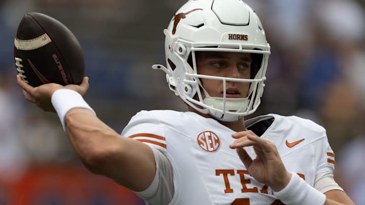 Texas quarterback Arch Manning warms up before an NCAA football game against Florida in Gainesville, FL.