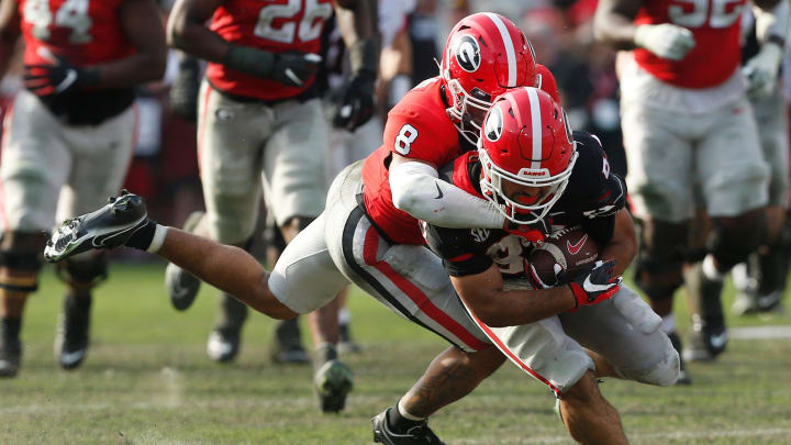 Georgia defensive back Joenel Aguero (8) tackles Georgia wide receiver Mekhi Mews (87) during the UGA G-Day spring football game at Sanford Stadium in Athens, Ga., on Saturday, April 15, 2023. Red won 31-26.

News Joshua L Jones