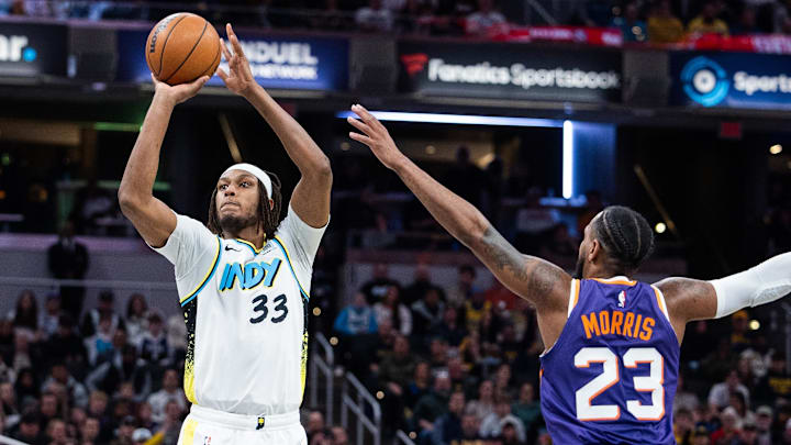 Jan 4, 2025; Indianapolis, Indiana, USA; Indiana Pacers center Myles Turner (33) shoots the ball against Phoenix Suns guard Monte Morris (23) in the second half at Gainbridge Fieldhouse. Mandatory Credit: Trevor Ruszkowski-Imagn Images Jan 4, 2025; Indianapolis, Indiana, USA; Indiana Pacers center Myles Turner (33) shoots the ball against Phoenix Suns guard Monte Morris (23) in the second half at Gainbridge Fieldhouse. Mandatory Credit: Trevor Ruszkowski-Imagn Images