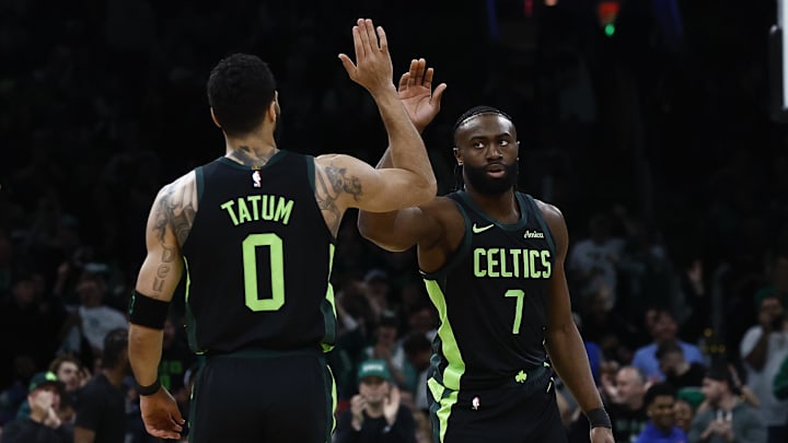 Feb 28, 2025; Boston, Massachusetts, USA; Boston Celtics guard Jaylen Brown (7) high fives forward Jayson Tatum (0) after the Cleveland Cavaliers called a timeout during the first quarter at TD Garden. Mandatory Credit: Winslow Townson-Imagn Images