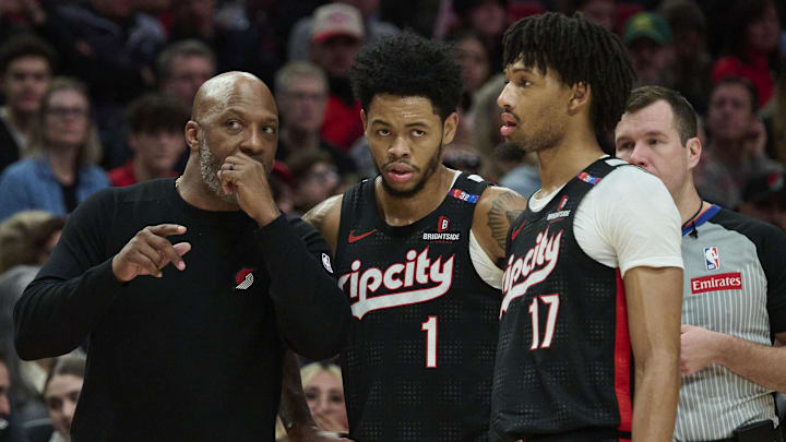 Jan 11, 2025; Portland, Oregon, USA; Portland Trail Blazers head coach Chauncey Billups talks to Portland Trail Blazers guard Anfernee Simons (1) and guard Shaedon Sharpe (17) during the second half against the Miami Heat at Moda Center. Mandatory Credit: Troy Wayrynen-Imagn Images