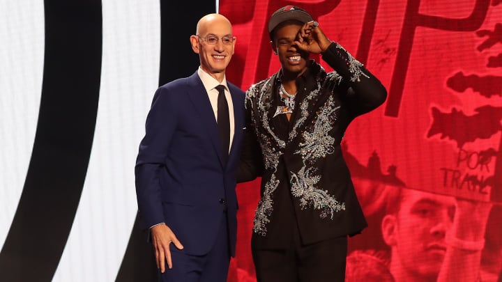 Jun 22, 2023; Brooklyn, NY, USA; Scoot Henderson with NBA commissioner Adam Silver after being selected third by the Portland Trail Blazers in the first round of the 2023 NBA Draft at Barclays Arena. Mandatory Credit: Wendell Cruz-USA TODAY Sports