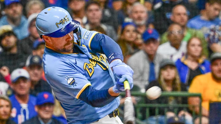 Sep 27, 2024; Milwaukee, Wisconsin, USA;  Milwaukee Brewers first baseman Rhys Hoskins (12) hits a grand slam home run against the New York Mets in the first inning at American Family Field. Mandatory Credit: Benny Sieu-Imagn Images