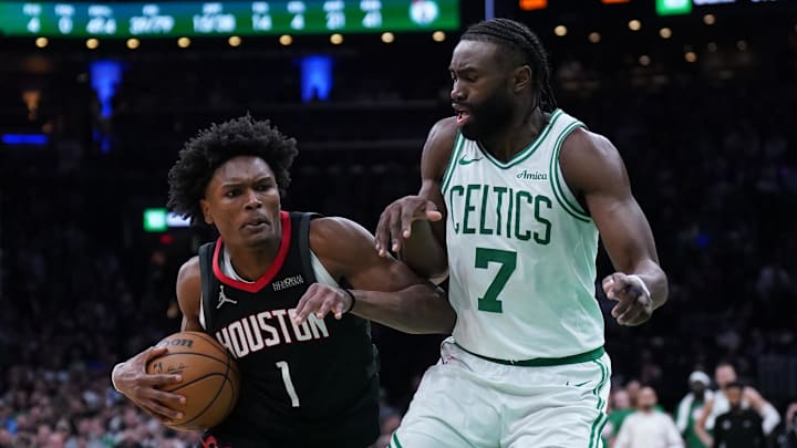 Jan 27, 2025; Boston, Massachusetts, USA; Houston Rockets forward Amen Thompson (1) drives the ball to the basket against Boston Celtics guard Jaylen Brown (7) in the last seconds of then game at TD Garden. Mandatory Credit: David Butler II-Imagn Images