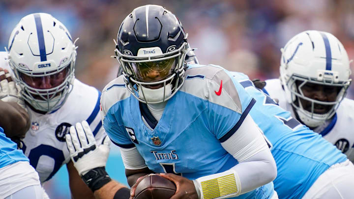 Tennessee Titans quarterback Cam Ward (1) maneuvers against the Indianapolis Colts during the first quarter at Nissan Stadium in Nashville, Tenn., Sunday, Sept. 21, 2025.