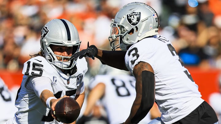 Nov 3, 2024; Cincinnati, Ohio, USA; Las Vegas Raiders quarterback Gardner Minshew (15) hands the ball off to running back Zamir White (3) in the first half against the Cincinnati Bengals at Paycor Stadium. Mandatory Credit: Katie Stratman-Imagn Images