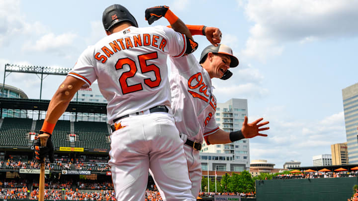 Baltimore Orioles left fielder Austin Hays (21) celebrates with Anthony Santander (25)
