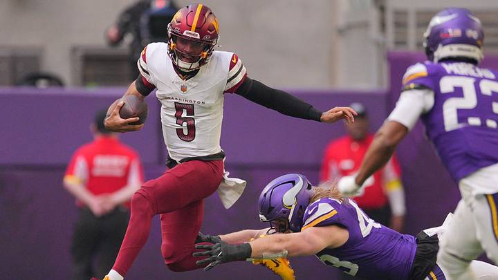 Dec 7, 2025; Minneapolis, Minnesota, USA; Washington Commanders quarterback Jayden Daniels (5) rushes the ball past Minnesota Vikings outside linebacker Andrew van Ginkel (43) during the first half at U.S. Bank Stadium. Mandatory Credit: Brad Rempel-Imagn Images