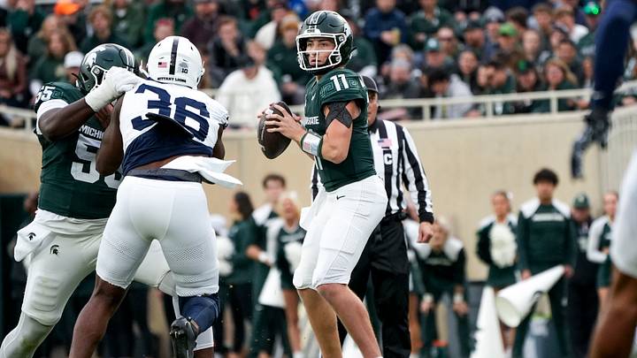 Nov 15, 2025; East Lansing, Michigan, USA; Michigan State quarterback Alessio Milivojevic (11) looks for an open receiver in the first quarter during a game against Penn State at Spartan Stadium. Mandatory Credit: Brendan Mullin-Imagn Images Nov 15, 2025; East Lansing, Michigan, USA; Michigan State quarterback Alessio Milivojevic (11) looks for an open receiver in the first quarter during a game against Penn State at Spartan Stadium. Mandatory Credit: Brendan Mullin-Imagn Images