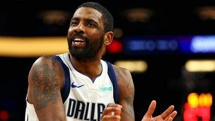 Dec 27, 2024; Phoenix, Arizona, USA; Dallas Mavericks guard Kyrie Irving (11) reacts to a play during the second quarter against the Phoenix Suns at Footprint Center. Mandatory Credit: Mark J. Rebilas-Imagn Images