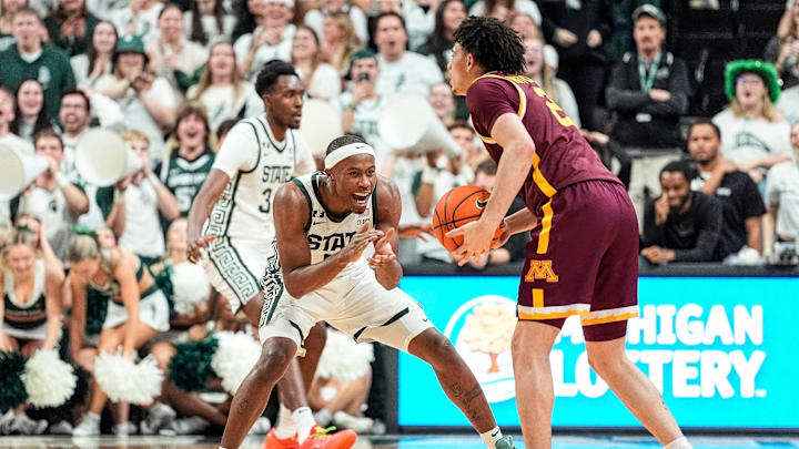 Michigan State guard Tre Holloman (5) defends Minnesota guard Mike Mitchell Jr. (2) during the first half at Breslin Center in East Lansing on Tuesday, Jan. 28, 2025.