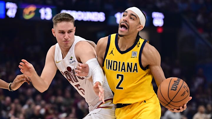 May 4, 2025; Cleveland, Ohio, USA; Indiana Pacers guard Andrew Nembhard (2) drives to the basket against Cleveland Cavaliers guard Sam Merrill (5) during the first half in game one of the second round for the 2025 NBA Playoffs at Rocket Arena. Mandatory Credit: Ken Blaze-Imagn Images