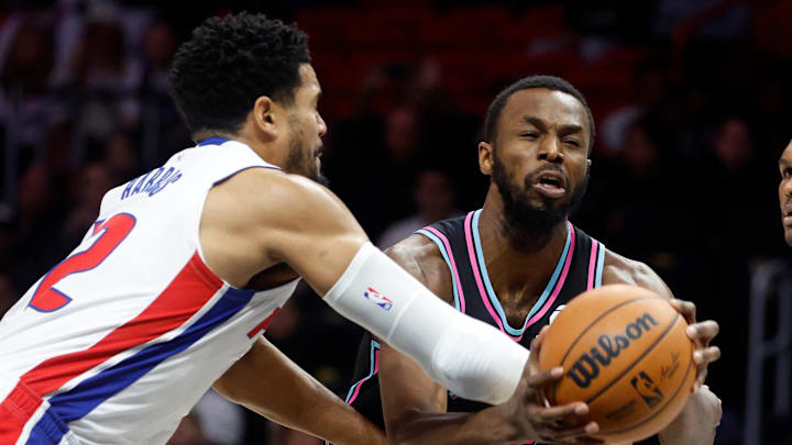 Nov 29, 2025; Miami, Florida, USA; Detroit Pistons forward Tobias Harris (12) fouls Miami Heat forward Andrew Wiggins (22) during the first half at Kaseya Center. Mandatory Credit: Rhona Wise-Imagn Images