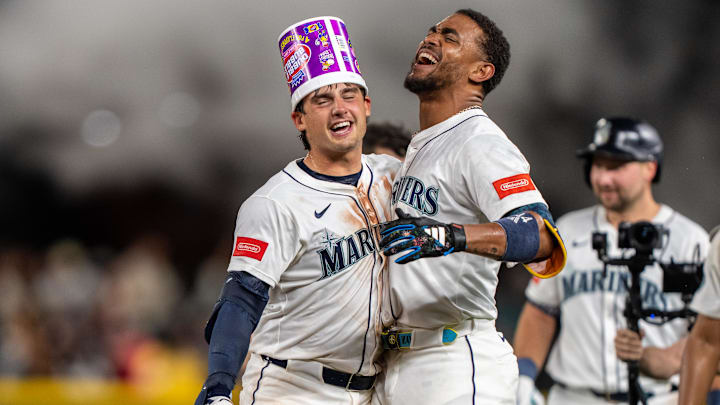 Seattle Mariners second baseman Cole Young (left) celebrates after hitting a walk-off single against the Houston Astros on July 19 at T-Mobile Park. Seattle Mariners second baseman Cole Young (left) celebrates after hitting a walk-off single against the Houston Astros on July 19 at T-Mobile Park.