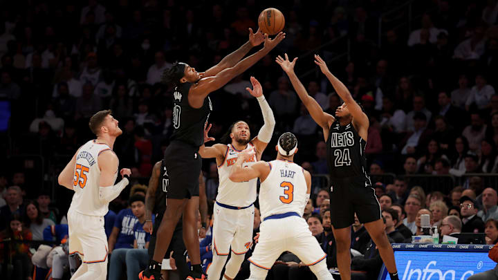 Feb 13, 2023; New York, New York, USA; Brooklyn Nets center Day'Ron Sharpe (20) and guard Cam Thomas (24) fight for a loose ball against New York Knicks center Isaiah Hartenstein (55) and guards Jalen Brunson (11) and Josh Hart (3) during the third quarter at Madison Square Garden. Mandatory Credit: Brad Penner-Imagn Images