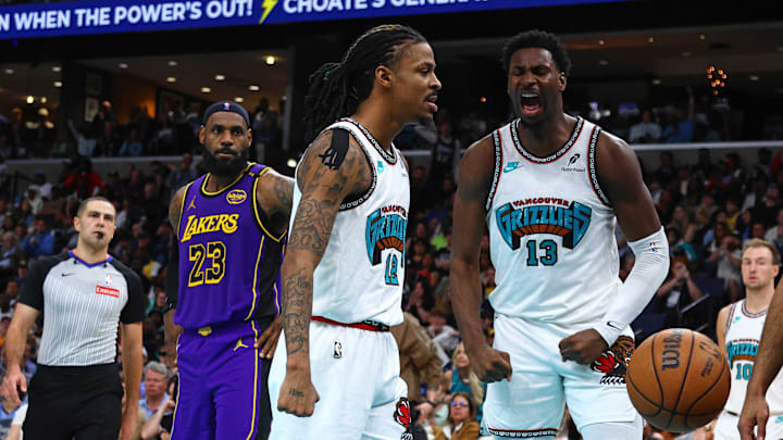 Mar 29, 2025; Memphis, Tennessee, USA; Memphis Grizzlies guard Ja Morant (12) and forward Jaren Jackson Jr. (13) react during the third quarter against the Los Angeles Lakers at FedExForum. Mandatory Credit: Petre Thomas-Imagn Images