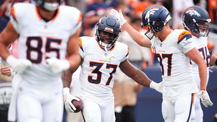 Aug 25, 2024; Denver, Colorado, USA; Denver Broncos running back Audric Estime (37) celebrates his touchdown with wide receiver David Sills V (87) in the first quarter against the Arizona Cardinals at Empower Field at Mile High. Aug 25, 2024; Denver, Colorado, USA; Denver Broncos running back Audric Estime (37) celebrates his touchdown with wide receiver David Sills V (87) in the first quarter against the Arizona Cardinals at Empower Field at Mile High.