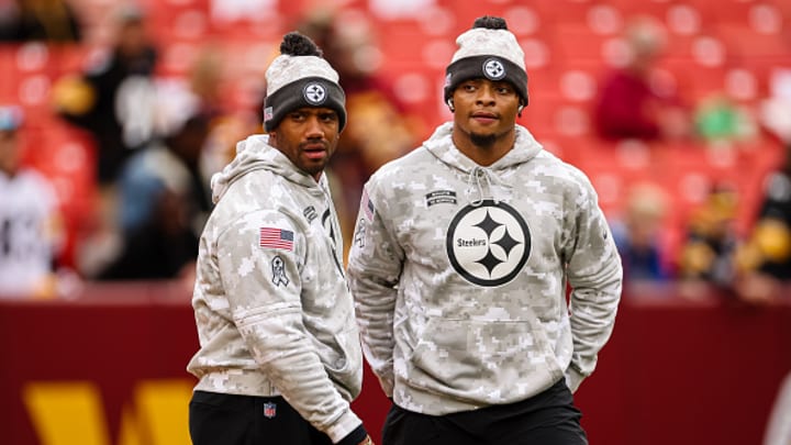 Russell Wilson #3 and Justin Fields #2 of the Pittsburgh Steelers look on before the game against the Washington Commanders at Northwest Stadium on November 10, 2024 in Landover, Maryland. 
