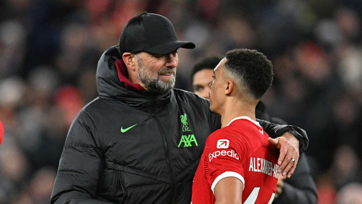 Jurgen Klopp manager of Liverpool and Trent Alexander-Arnold of Liverpool at the end of the Premier League match between Liverpool FC and Arsenal FC at Anfield on December 23, 2023 in Liverpool, England. 