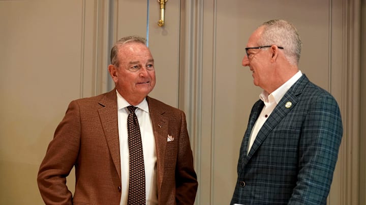 Texas head coach Vic Schaefer talks with SEC Commissioner Greg Sankey during SEC Media Day at the Grand Bohemian Hotel in Mountain Brook Tuesday, Oct. 16, 2024.