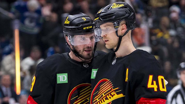 Vancouver Canucks centers J.T. Miller and Elias Pettersson (40). 