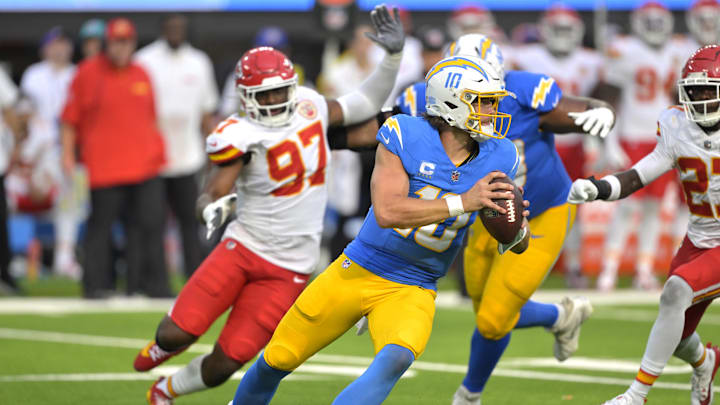 Sep 29, 2024; Inglewood, California, USA; Los Angeles Chargers quarterback Justin Herbert (10) is pressured by Kansas City Chiefs defensive end Felix Anudike-Uzomah (97) in the second half at SoFi Stadium. Mandatory Credit: Jayne Kamin-Oncea-Imagn Images Sep 29, 2024; Inglewood, California, USA; Los Angeles Chargers quarterback Justin Herbert (10) is pressured by Kansas City Chiefs defensive end Felix Anudike-Uzomah (97) in the second half at SoFi Stadium. Mandatory Credit: Jayne Kamin-Oncea-Imagn Images
