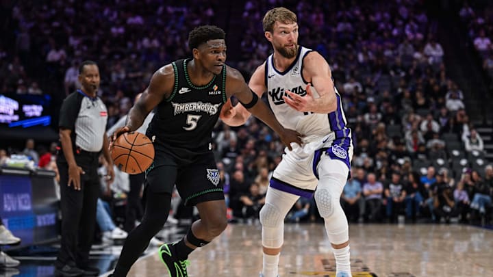Nov 9, 2025; Sacramento, California, USA; Minnesota Timberwolves guard Anthony Edwards (5) dribbles the ball against Sacramento Kings forward Domantas Sabonis (11) during the third quarter at Golden 1 Center.