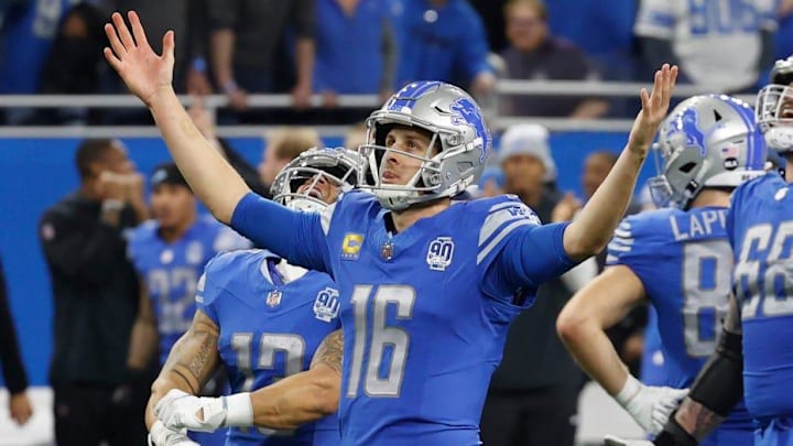 Detroit Lions quarterback Jared Goff (16) raises his arms as the Lions beat the L.A. Rams, 24-23 in the wild-card round of the NFC playoffs at Ford Field in Detroit on Sunday, January 14, 2023.