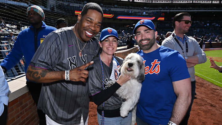 Westminster Kennel Club Dog Show 2023 Best in Show winner Buddy Holly with Busta Rhymes at Mets vs. Braves (photos by Roy Rochlin/Getty Images for Westminster Kennel Club)