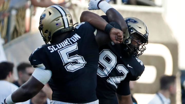 Purdue Boilermakers linebacker Nic Scourton (5) and Purdue Boilermakers defensive lineman Mo Omonode