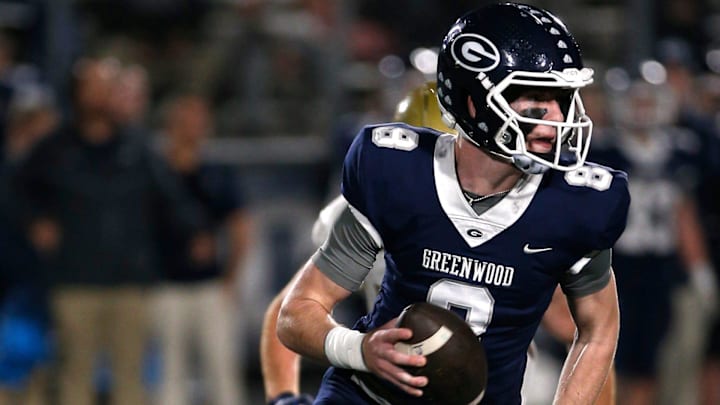 Greenwood's Kane Archer is chased out of the pocket by a Pulaski Academy defender while looking for a receiver during the 5A West Conference game on Oct. 28 at Smith Robinson Stadium.

Greenwood Pul Acad Fb 102822 04