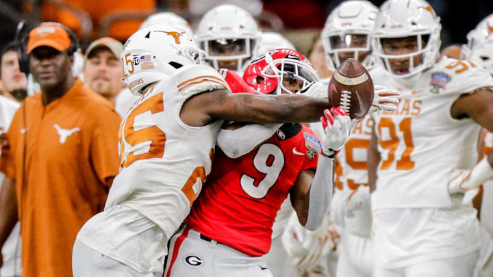 Jan 1, 2019; New Orleans, LA, USA; Texas Longhorns defensive back B.J. Foster (25) knocks the ball away from Georgia Bulldogs wide receiver Jeremiah Holloman (9) in the third quarter in the 2019 Sugar Bowl at Mercedes-Benz Superdome. Mandatory Credit: Stephen Lew-Imagn Images