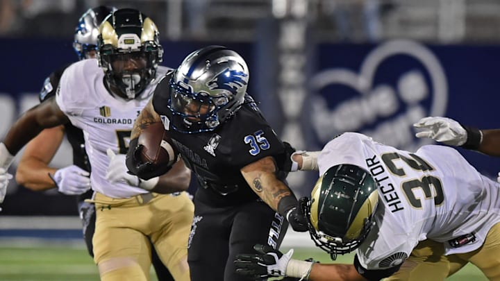 Nevada's Toa Taua fights off Colorado State's Ayden Hector in Firday's game at Nevada on Oct. 7, 2022. Colorado State won 17-14.

Football Colorado State At Nevada 7