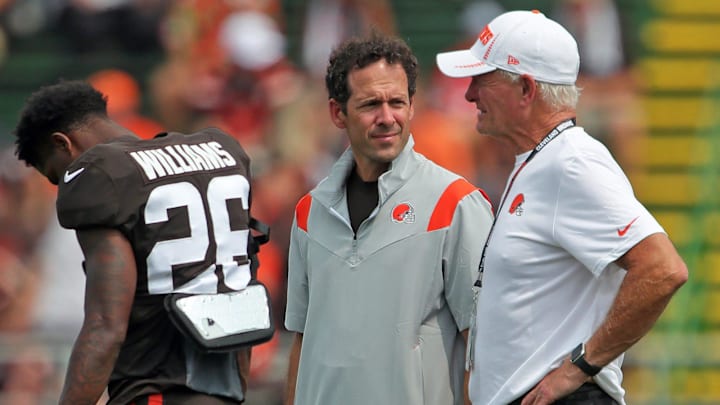 Cleveland Browns chief strategy officer Paul DePodesta, left, and owner Jimmy Haslam, right, chat on the sideline during practice, Tuesday, Aug. 10, 2021, in Berea, Ohio.