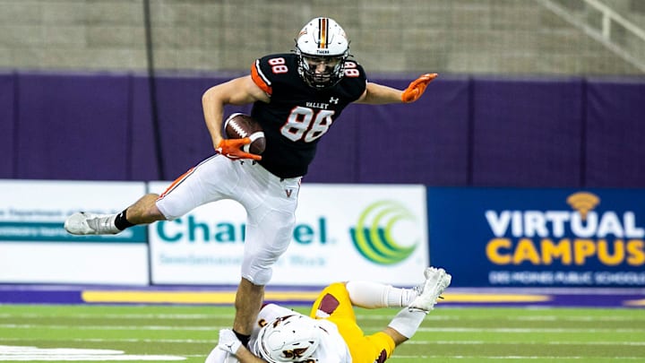 West Des Moines Valley's Eli Raridon (88) gets tackled by Ankeny's Will Cornwell during a Class 5A semifinal football game, Friday, Nov. 12, 2021, at the UNI-Dome in Cedar Falls, Iowa.

211112 Valley Ankeny Fb 010 Jpg