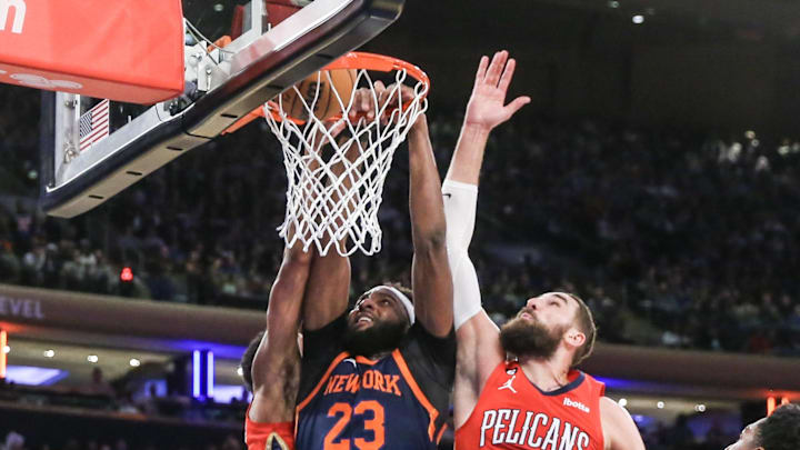 Feb 25, 2023; New York, New York, USA; New York Knicks center Mitchell Robinson (23) dunks past New Orleans Pelicans center Jonas Valanciunas (17) in the second quarter at Madison Square Garden. Feb 25, 2023; New York, New York, USA; New York Knicks center Mitchell Robinson (23) dunks past New Orleans Pelicans center Jonas Valanciunas (17) in the second quarter at Madison Square Garden.