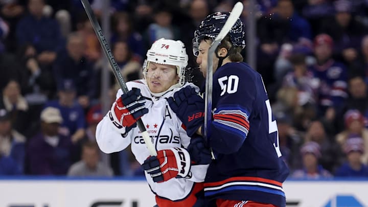 Jan 14, 2024; New York, New York, USA; New York Rangers left wing Will Cuylle (50) hits Washington