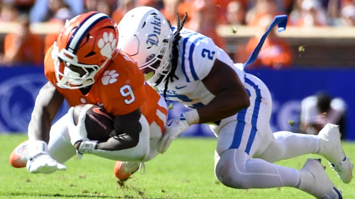 Clemson Tigers running back Gideon Davidson (9) is tackled by Duke Blue Devils linebacker Jaiden Francois (2) Saturday, Nov. 1, 2025, during the NCAA football game at Memorial Stadium in Clemson, South Carolina.
