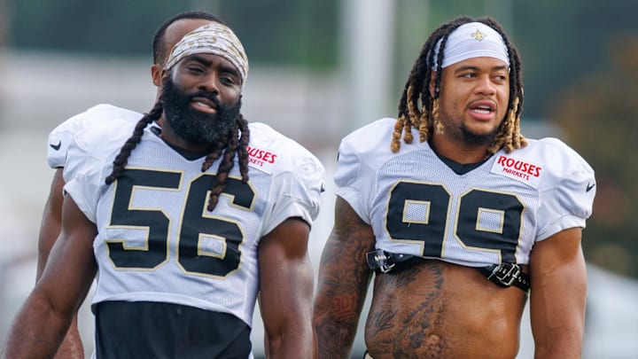 Jul 30, 2025; New Orleans, LA, USA;  New Orleans Saints linebacker Demario Davis (56) and defensive end Chase Young (99) during training camp at Ochsner Sports Performance Center. Mandatory Credit: Stephen Lew-Imagn Images