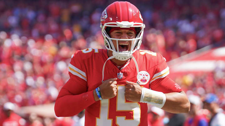 Aug 17, 2024; Kansas City, Missouri, USA; Kansas City Chiefs quarterback Patrick Mahomes (15) celebrates toward fans against the Detroit Lions prior to the game at GEHA Field at Arrowhead Stadium. Mandatory Credit: Denny Medley-Imagn Images