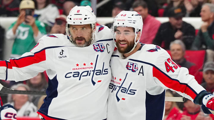 Washington Capitals left wing Ovechkin celebrates his goal with  right wing Wilson against the Carolina Hurricanes during the second period at Lenovo Center. 