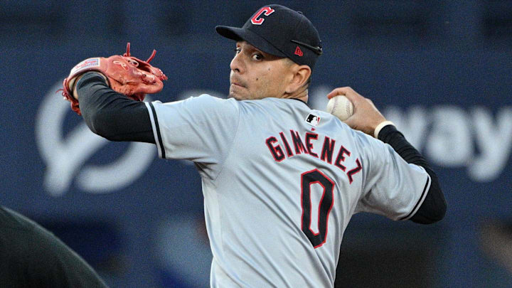 Jun 14, 2024; Toronto, Ontario, CAN;  Cleveland Guardians second baseman Andres Gimenez (0) prepares to throw to first base on an infield single hit by Toronto Blue Jays catcher Danny Jansen (not shown) in the sixth inning at Rogers Centre. Mandatory Credit: Dan Hamilton-Imagn Images