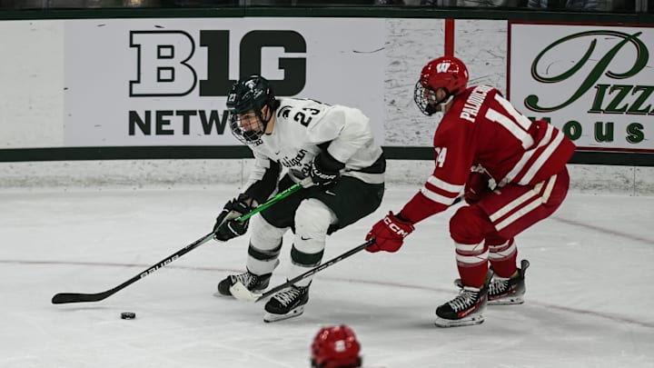 MSU's Shane Vansaghi moves the puck against Wisconsin, Thursday, Jan. 2, 2024, at Munn Ice Arena. MSU won 4-3.