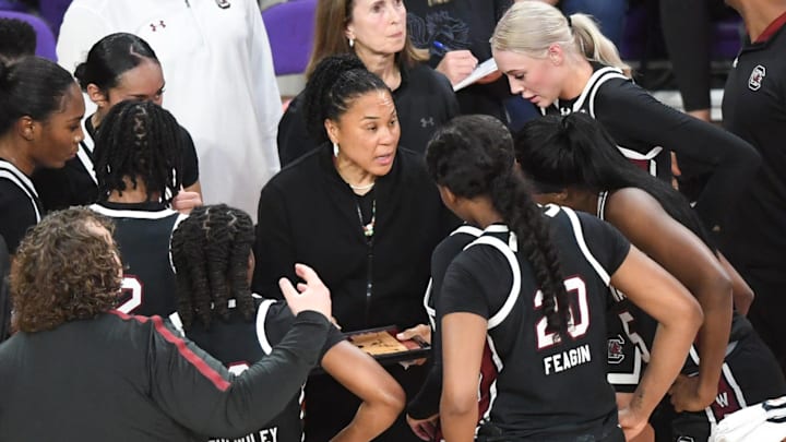 South Carolina Coach Dawn Staley talks with players in a break from playing Clemson during the second quarter at Littlejohn Coliseum Wednesday, November 20, 2024; Clemson, SC, USA.