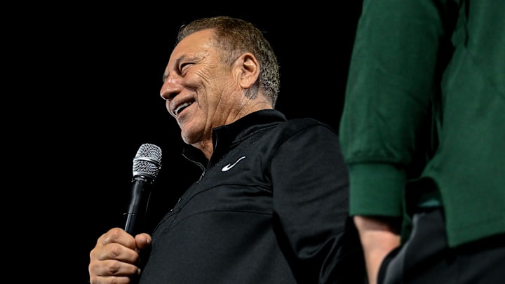 Tom Izzo looks on as team members crowd surf during the Izzone campout on Friday, Oct. 4, 2024, at Munn Field in East Lansing.