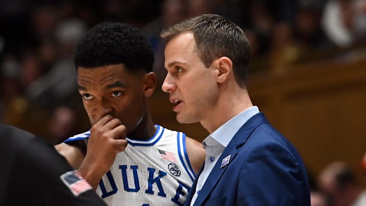 Jan 27, 2024; Durham, North Carolina, USA; Duke basketball head coach Jon Scheyer talks to guard Caleb Foster