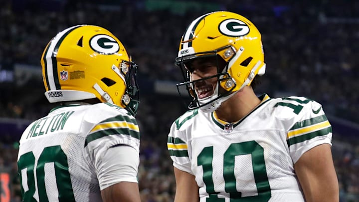 Green Bay Packers wide receiver Bo Melton (80) celebrates his touchdown reception with quarterback