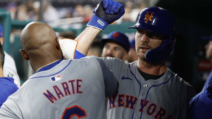 Jun 4, 2024; Washington, District of Columbia, USA; New York Mets first base Pete Alonso (20) celebrates with Mets outfielder Starling Marte (6) in the dugout after hitting a home run against the Washington Nationals during the ninth inning at Nationals Park. Mandatory Credit: Geoff Burke-USA TODAY Sports